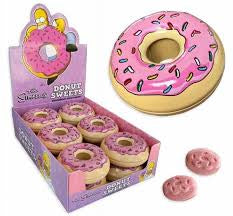 The Simpsons Donut Sweets Candy Tin, a collectible tin shaped like Homer Simpson's iconic pink frosted donut, filled with strawberry donut-flavored candies